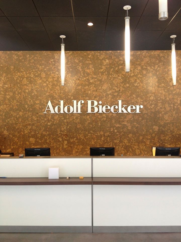 Adolf Biecker Studio large logo at front desk